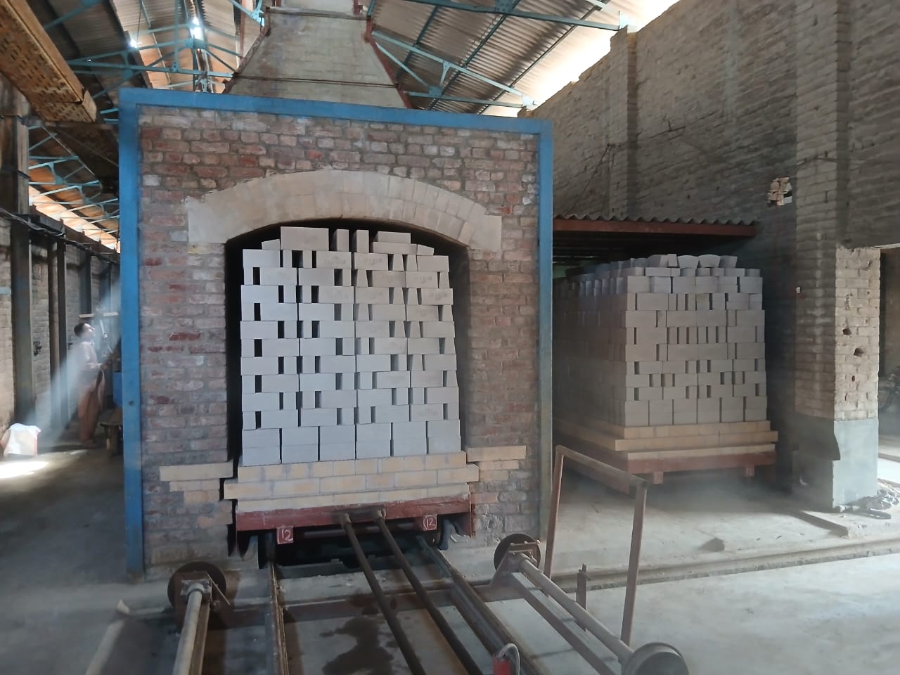 Pressing refractory elements